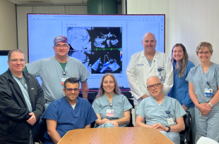 The team at Corewell Health Dearborn Hospital includes: (Sitting from left to right) •	Dr. Joseph Chattahi, Interventional and Structural Heart Cardiologist, Director Structural Heart Program •	Dr. Rita Coram, Interventional and Structural Heart Cardiologist, Medical Director Cath Lab •	Dr. Samir Dabbous, Interventional and Structural Heart Cardiologist  (Standing from left to right) •	Roger Claypool, BSN, RN, Clinical Manager Cath Lab •	Dr. Phillip Camp, Cardiac Surgery •	Dennis Hoy, MSA, BSN, RN, Director of Cardiovascular Services •	Sara Young, FMP-C, RN •	Karen Cooley, BSN, RN, Nurse Navigator Structural Heart Program  (Not pictured) •	Dr. Timothy Sell, Medical Director CV Surgery •	Dr. Omar Ali, Interventional and Structural Heart Cardiologist